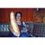 Woman with a large zucchini