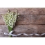 Lilies of the valley on the background of a wooden wall