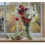 Flowers in a vase, apples on the windowsill