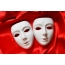 White masks on a red background