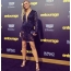 Ronda in a chic dress with a deep neckline