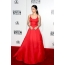 Selena in a red dress with a full skirt