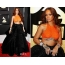 Rihanna yn oranje top en swarte rok