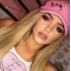 Blonde in a pink baseball cap