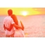 Guy and girl, sea, sunset