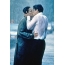 Boy and girl kiss in the rain