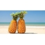 A pair of pineapples on the beach