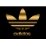 Adidas zlatý znak na čiernom pozadí