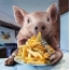 フライドポテトを食べる豚